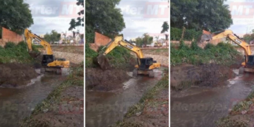 Escavadeira da Prefeitura é flagrada jogando barro de um lado pro outro dentro de córrego em Cuiabá